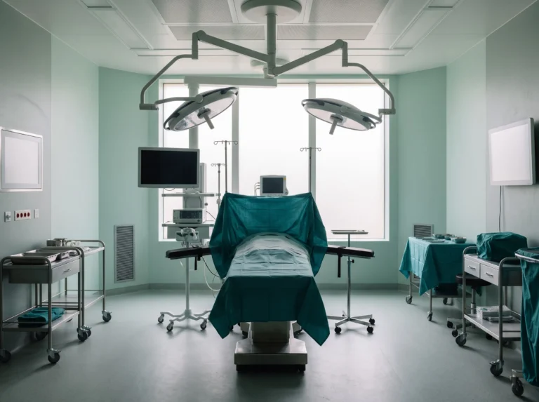 Day-case operating theatre with an operating table under surgical lights